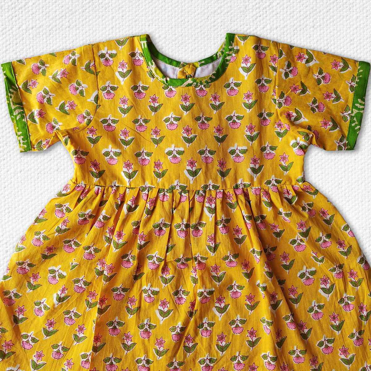 Fresh yellow Calf Length Frock With Green Border